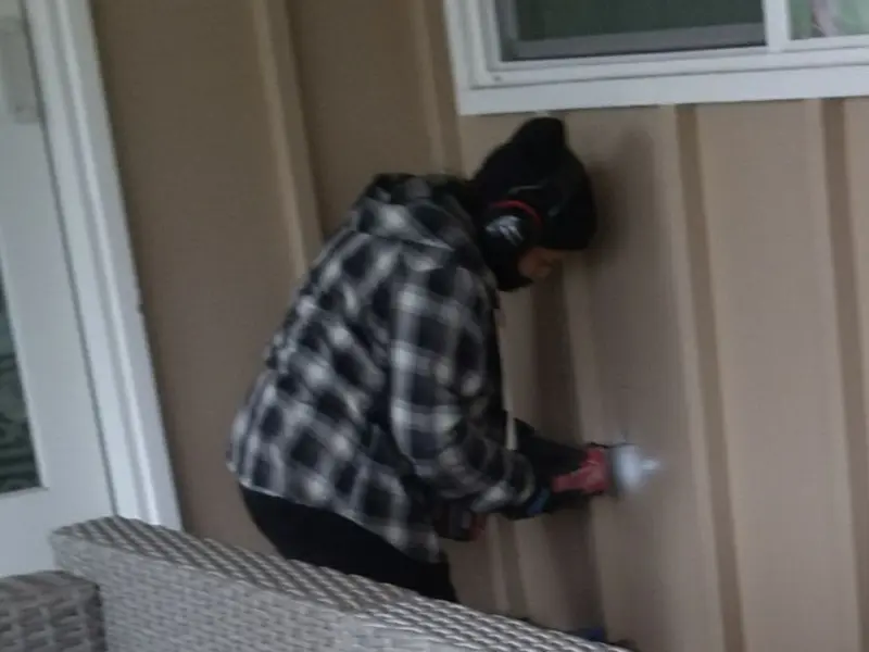Professional electrician installing an exterior outlet in Templeton